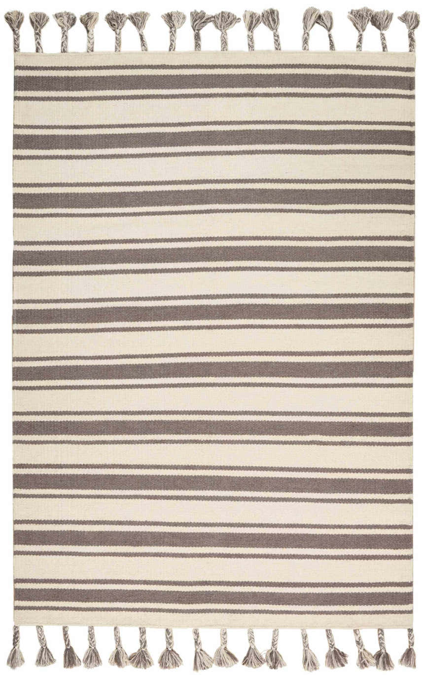 Close-up of the handmade Nourison Rio Vista rug with chestnut stripes and tasseled edges. Wool material.
