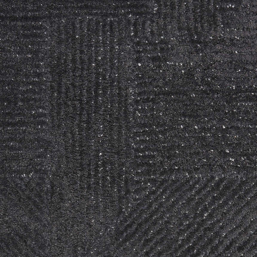 Close-up of the black Michael Amini MA30 Star rug. The handmade wool and rayon rug has a subtle, textured pattern.