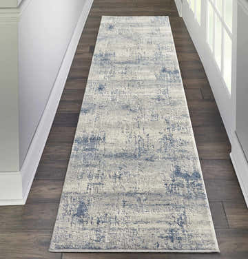 Hallway with dark wood floors and Nourison Rustic Textures Ivory Blue runner rug.
