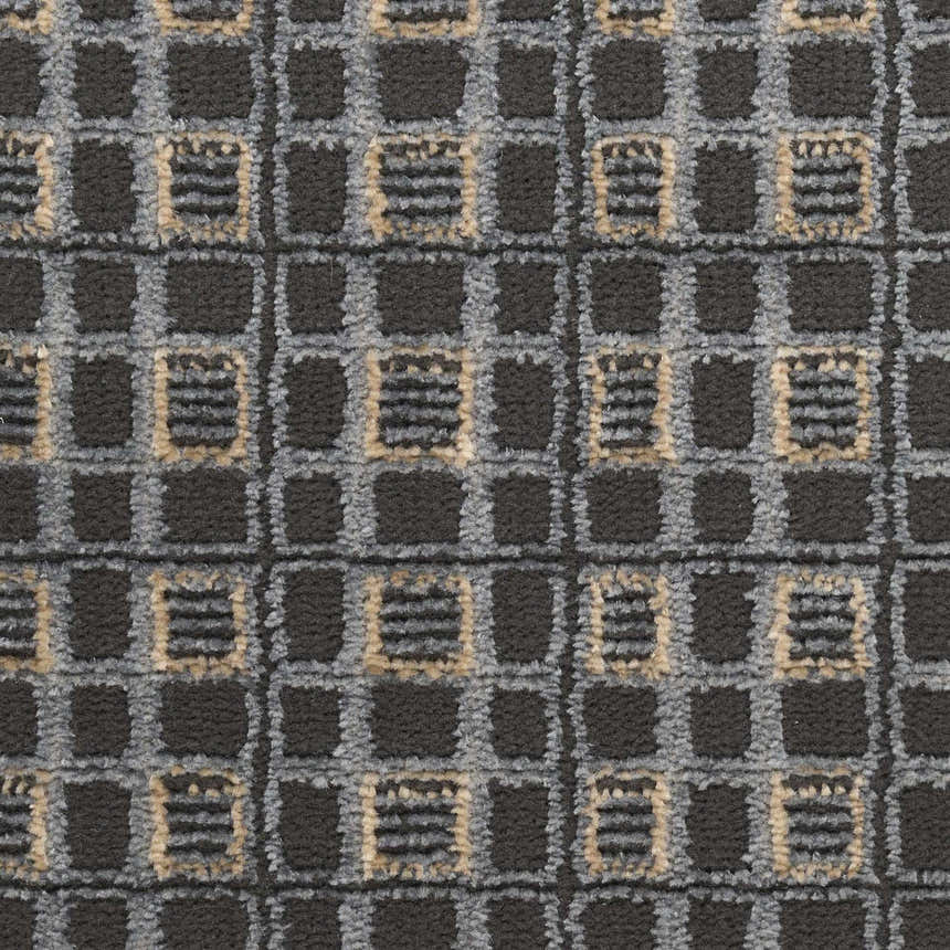 Close-up of the Nourison Nordic Black Taupe Art Deco Indoor Area Rug, featuring a geometric pattern and ivory accents.
