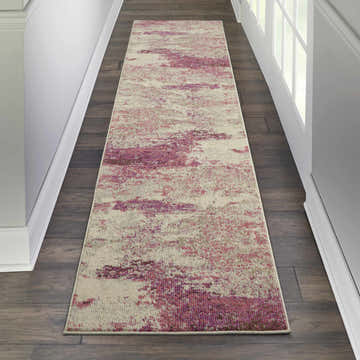 Hallway scene with a Nourison Celestial Ivory Pink rug runner on dark wood floors.