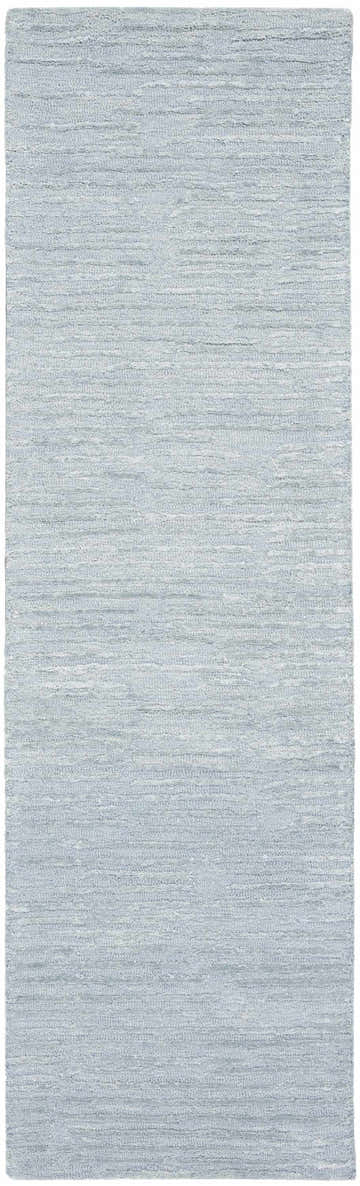 Close-up of the Calvin Klein CK010 Linear Light Blue rug. Handmade wool and cotton rug with a subtle, textured linear pattern.