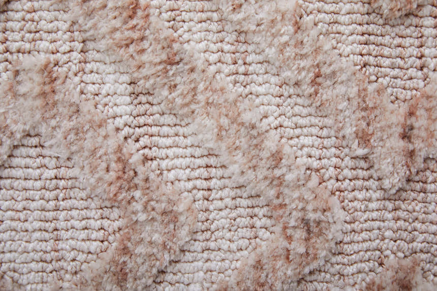 Close-up of the Feizy Colton Modern Diamond Pink/Ivory Area Rug showing texture and diamond pattern detail. Texture
