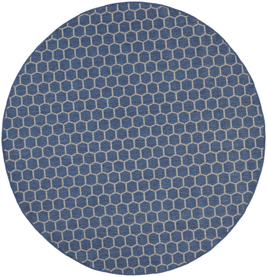 Close-up of a round Nourison Twist Reversible Blue rug with a modern geometric honeycomb pattern.