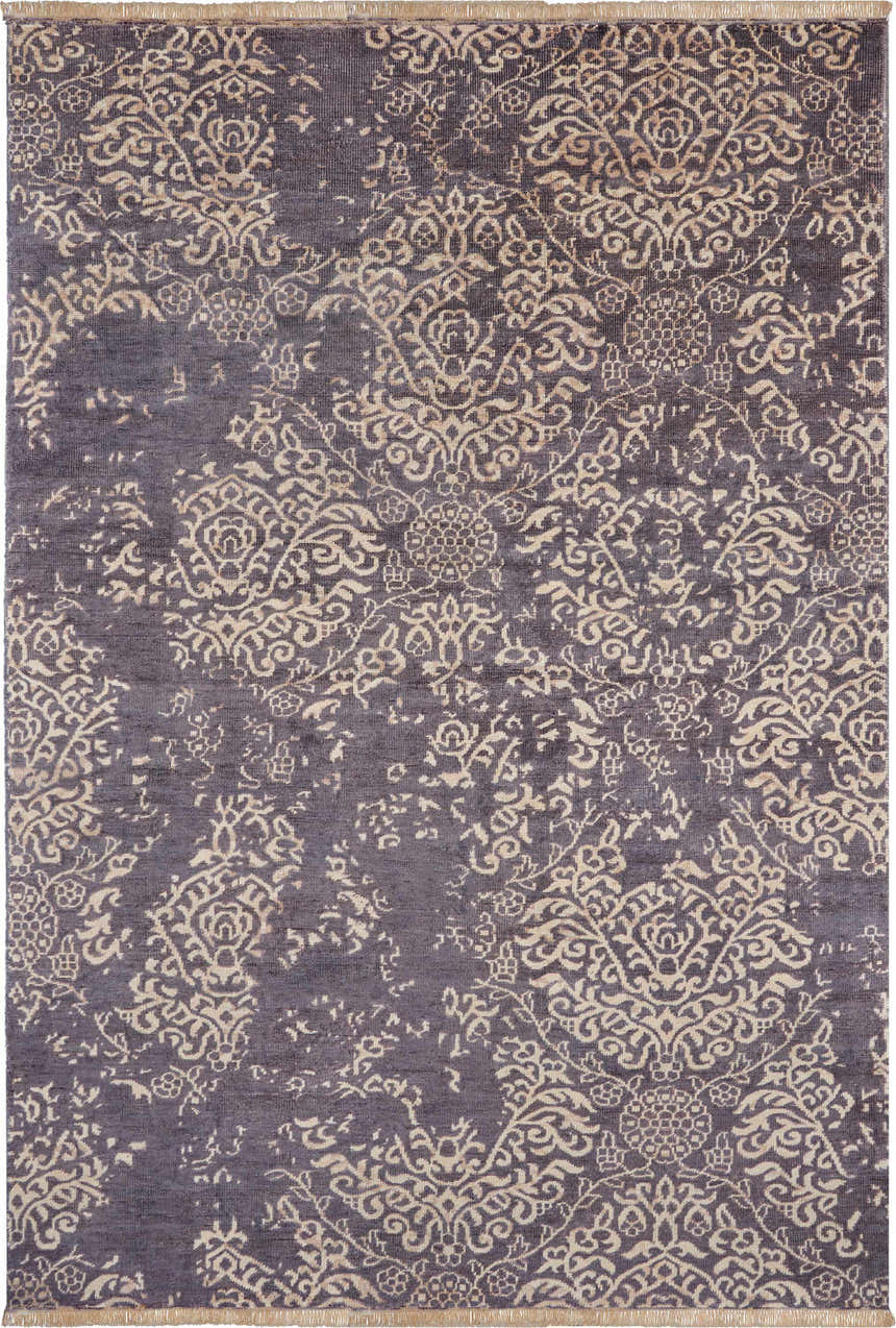 Close-up of the Nourison Aldora Royal Vintage rug. Royal-colored rug with a distressed, ornate floral pattern.