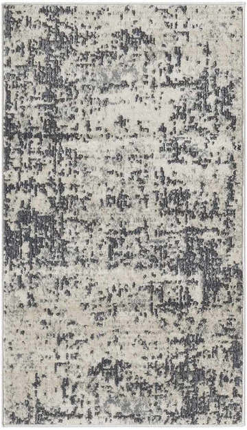 Close up of the Nourison Quarry Ivory Grey rug, showing its abstract chestnut pattern and machine-made texture.