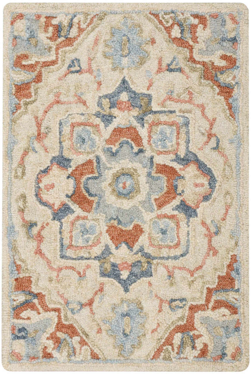 Close-up of Nourison Maison Ivory Rust Vintage Indoor Area Rug. Handmade pile rug with chestnut, ivory, and blue floral design.