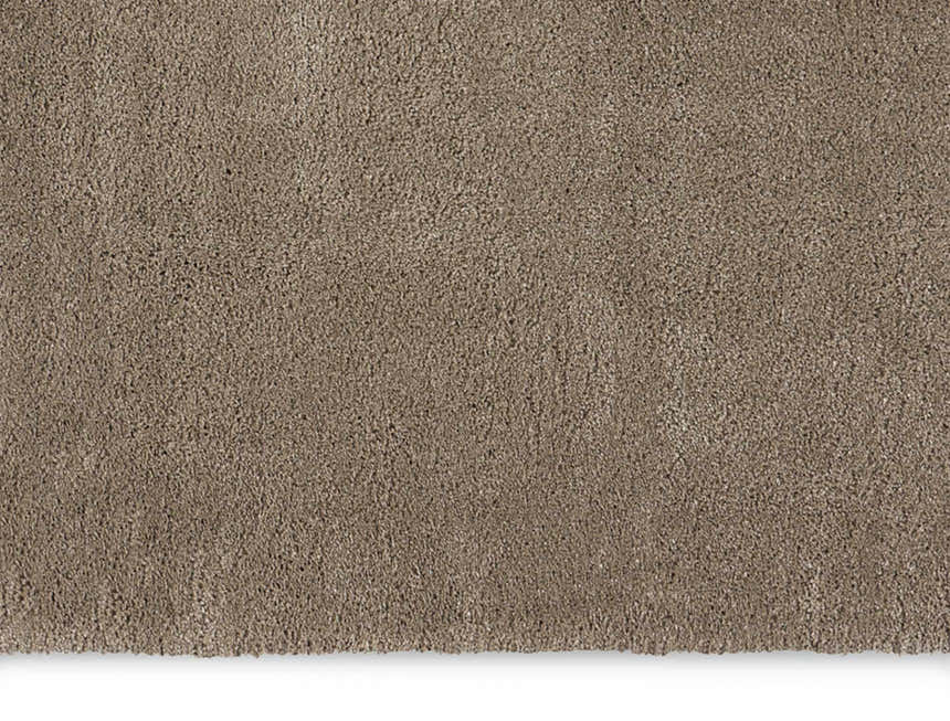 Close-up of the plush texture of a Calvin Klein Brooklyn Silver Gray shag rug.
