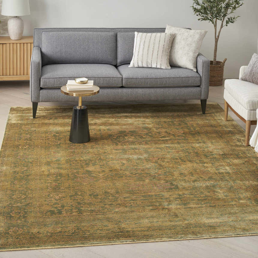 Living room scene with a gray sofa and the olive vintage Nourison Luxurious area rug.