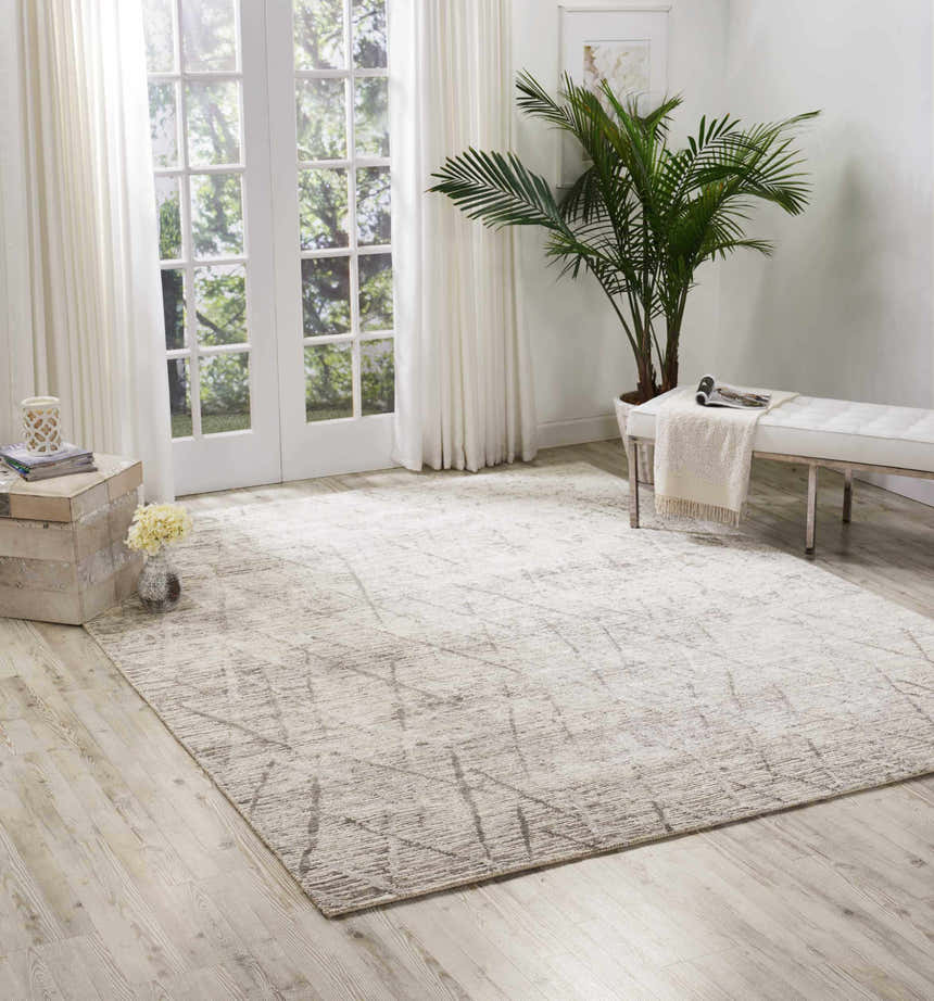 Bright living room with a sandstone Nourison OCEAN Stone Modern Indoor Area Rug.