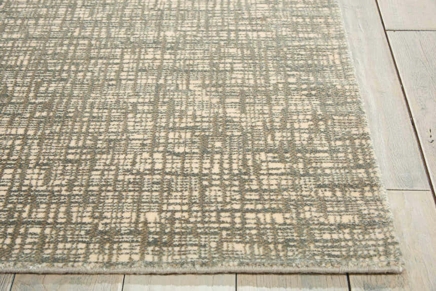 Close up of Nourison Starlight Sea Mist rug. Modern design with a grid pattern in sea mist and cream. Luxcelle material.