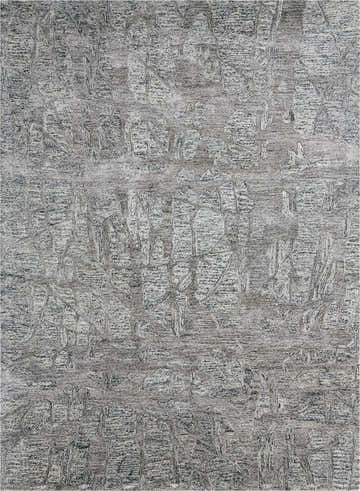 Close-up of the Nourison Gemstone Hematite rug. Features a textured, abstract pattern in shades of gray and white.