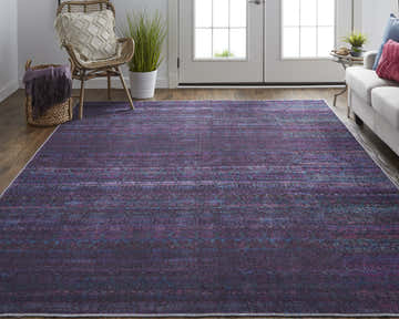 Living room scene with blue and purple Feizy Voss area rug, white sofa, and natural wood accents. Roomscene-Rectangle