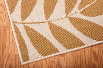 Close-up of the Nourison Caribbean Ivory rug showing its chestnut leaf pattern and textured weave.