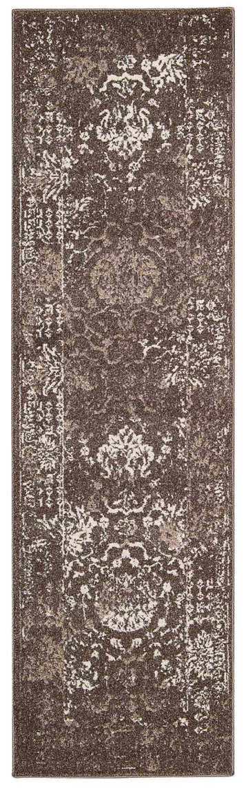 Close-up of the grey Michael Amini Glistening Nights rug. Features a distressed, mid-century modern design and soft texture.