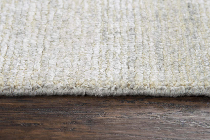Close-up of the hand-loomed Rizzy GH721A area rug. Ivory and silver gray wool and tencel fibers create a soft texture. Pile