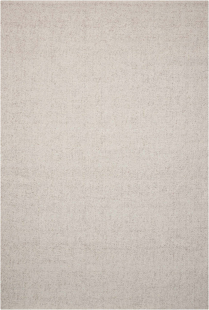 Close up of the Calvin Klein Home Tobiano Sand rug, showing its woven texture and sandstone color.