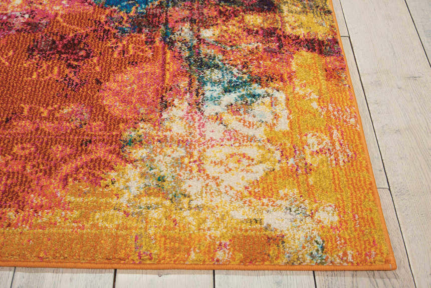 Close-up of the Nourison Celestial Seaglass rug. Features an abstract design in seaglass, orange, yellow, pink, and white hues.