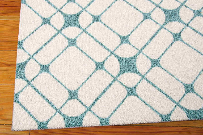 Close-up of Nourison Enhance Ivory/Turquoise runner rug. Geometric diamond pattern on a soft, textured pile.