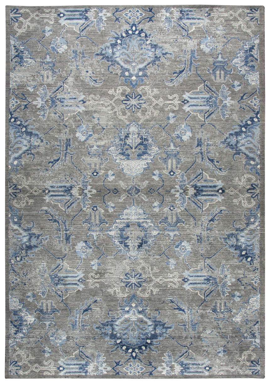 Close-up of the Rizzy GS7225 area rug. Farmhouse style rug with a gray background and blue and light gray floral pattern. Design-Rectangle