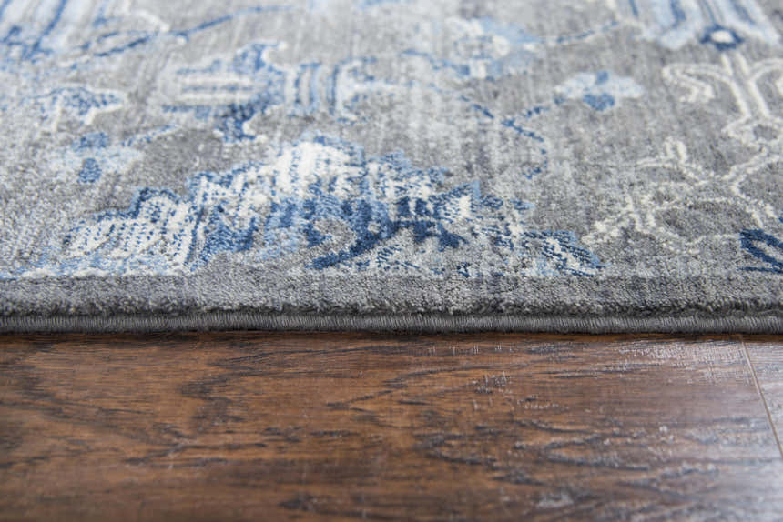 Close-up of the Rizzy GS7225 area rug, showing its gray and blue farmhouse design and soft New Zealand wool texture. Pile