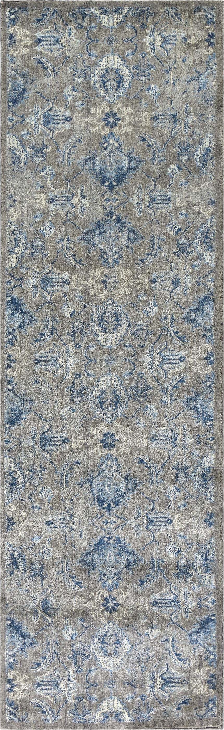 Close-up of the Rizzy GS7225 area rug. Farmhouse style rug in blue, gray, and light gray with a transitional floral pattern. Design-Runner