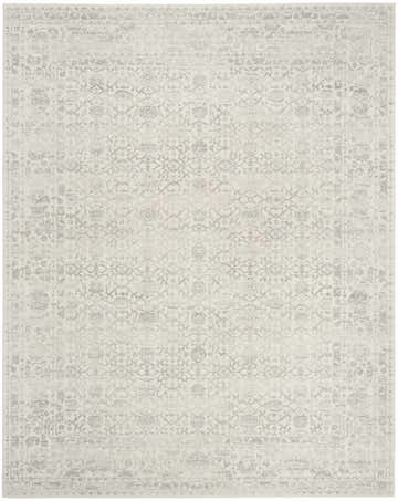 Close-up of the Nourison Grace Grey Vintage Area Rug, featuring a faded floral pattern and border detail.