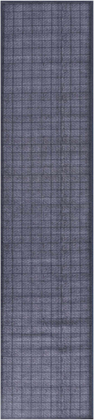 Close-up of the navy Nourison Washable Area Rug. Modern, machine-made weave with a subtle grid pattern. Rectangle shape.