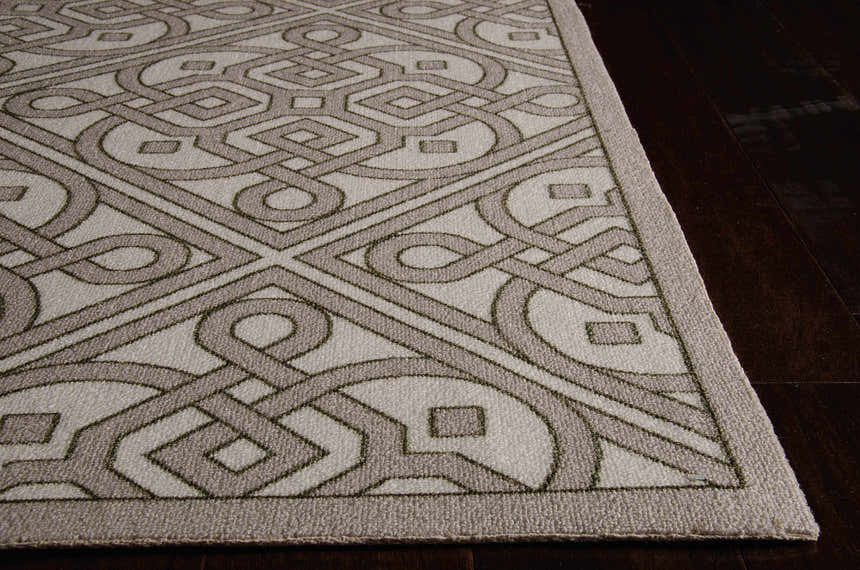 Close up of the Waverly Sun N' Shade Stone Modern Area Rug showing geometric sandstone pattern and texture.