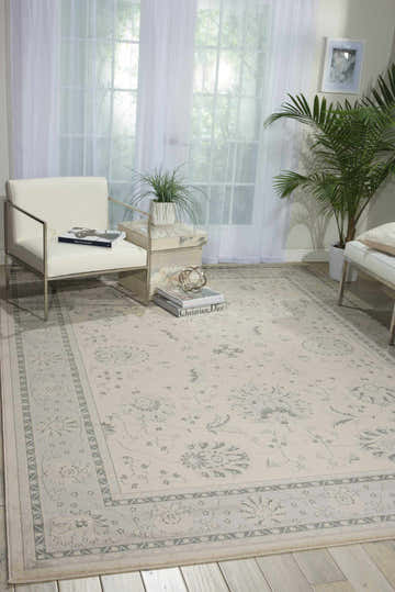 Bright living room with white furniture and Nourison Maymana Ivory Persian rug adding subtle pattern and warmth.