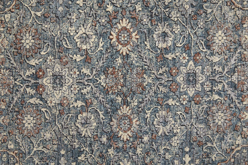 Close-up of the Feizy Marquette Transitional Oriental rug in blue and red, showcasing its floral pattern and soft texture. Texture