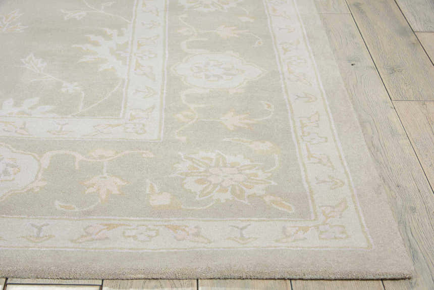 Close-up of the Nourison Zephyr Silver rug showing the wool texture and floral design.