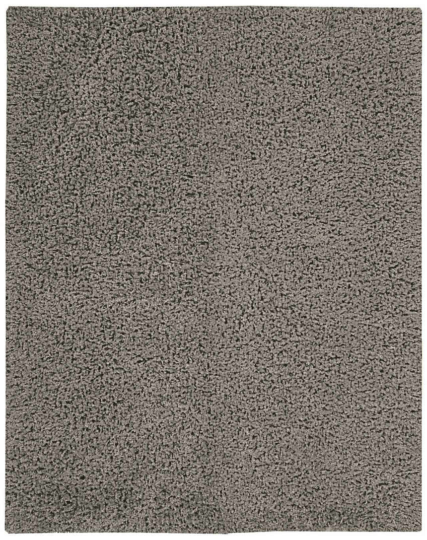Close-up of the plush texture of the grey Nourison Zen Shag rug. Handmade polyester shag rug.