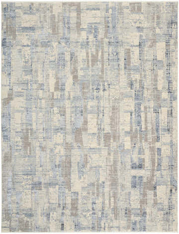 Close-up of Calvin Klein CK089 Drift rug. Modern design in blue, beige, and gray with a subtle, textured pattern.