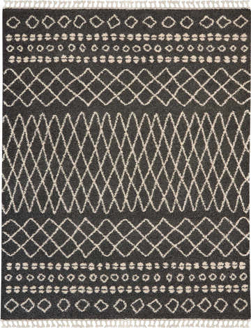 Close-up of the Nourison Moroccan Shag Charcoal Tribal Indoor Area Rug. Shag texture with taupe tribal diamond pattern.