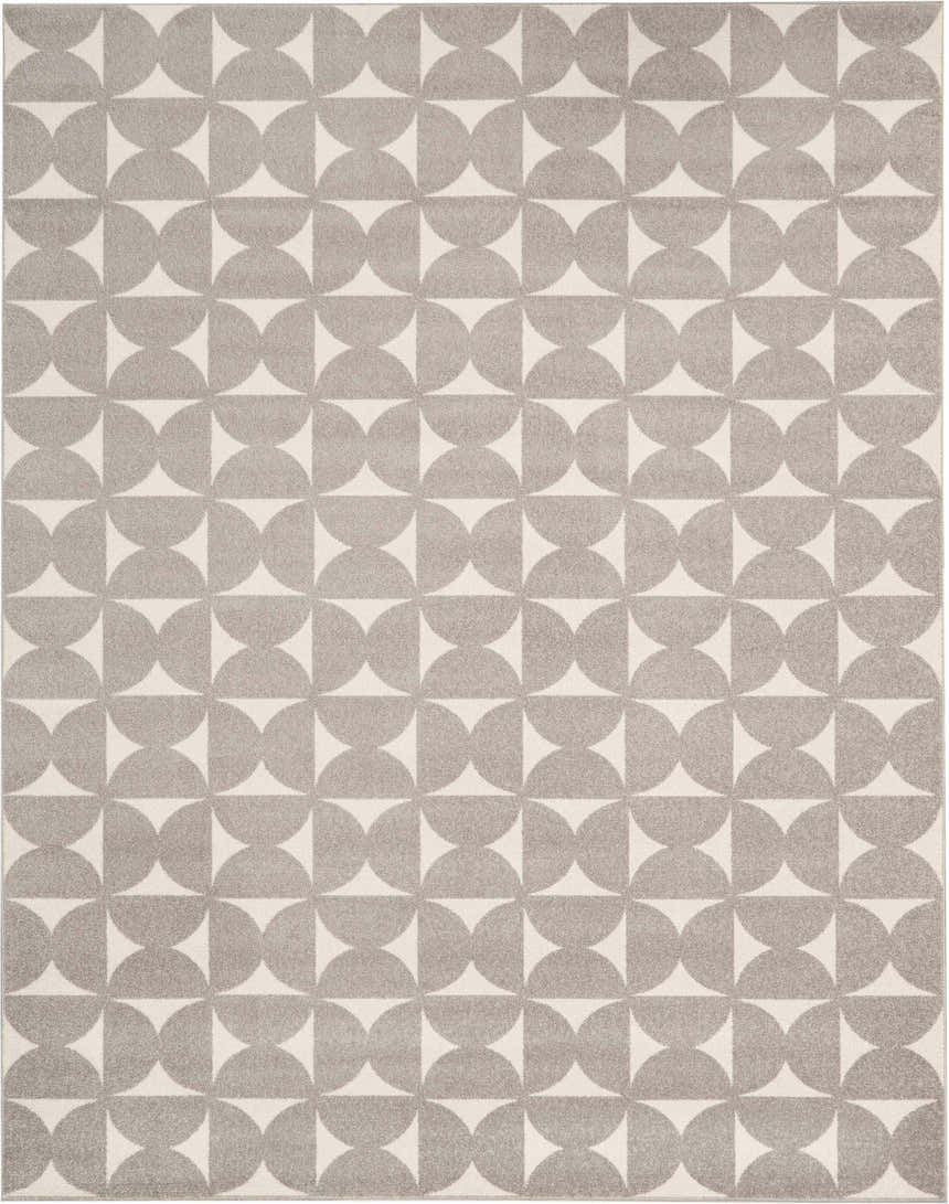 Close-up of the Nourison Harper Grey Colorful Indoor Area Rug, featuring a geometric half-circle pattern in gray and cream.
