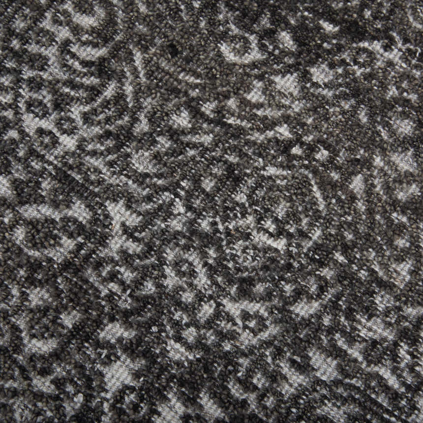 Close-up of the hand-knotted Rizzy HTN720 area rug. Gray and ivory wool with a traditional, farmhouse-style pattern. Texture