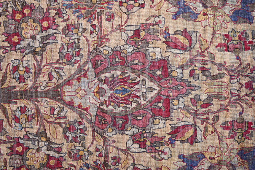 Close-up of Feizy Rawlins rug. Transitional oriental design in red, tan, and pink hues. Vintage farmhouse style. Texture
