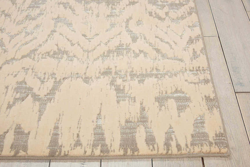 Close-up of the Nourison Nepal Ivory/Grey Vintage Area Rug showing its abstract chestnut pattern and soft texture.