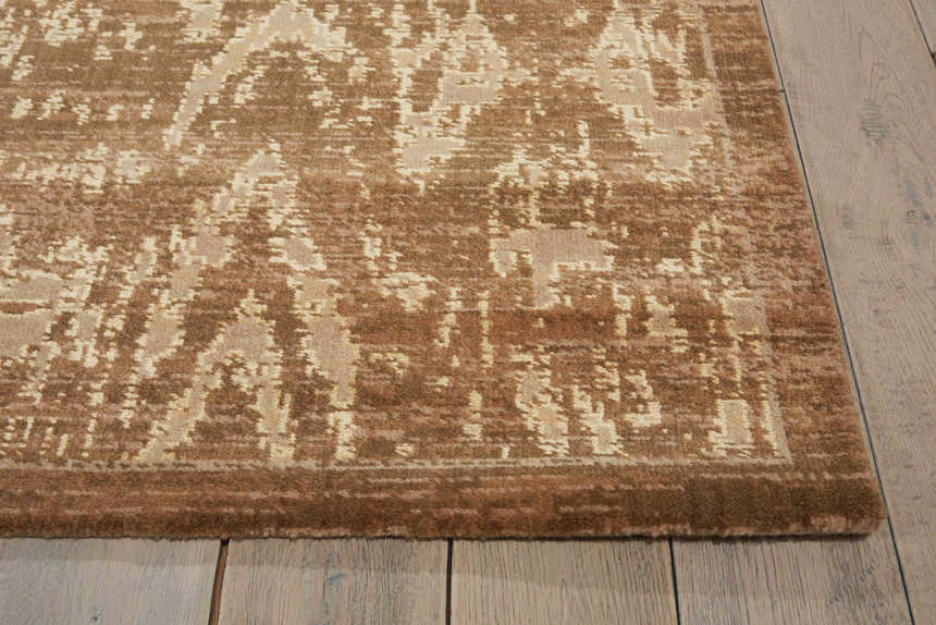Close-up of the chocolate brown Nourison Silken Allure Persian rug showing the wool texture and traditional design.