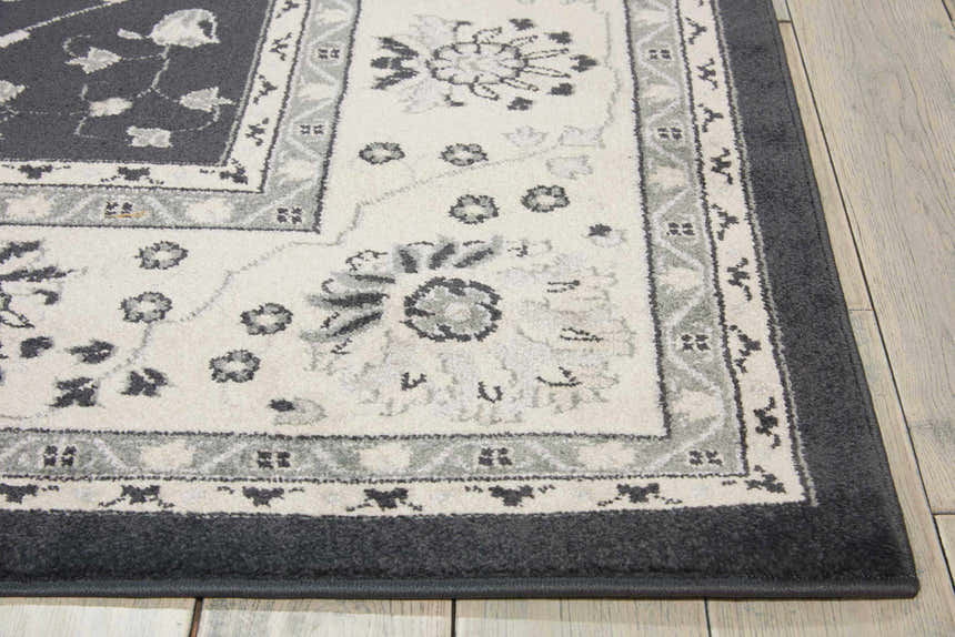 Close-up of the Nourison Maymana Charcoal Persian rug, showcasing its floral pattern and taupe color palette.