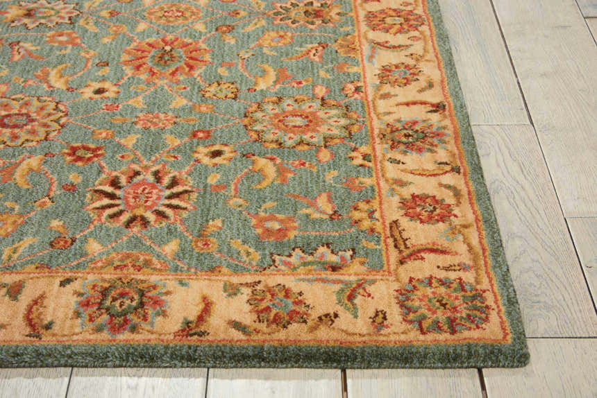 Close-up of Nourison Living Treasures Aqua rug. Traditional floral pattern in aqua, gold, and red. Wool rug texture.
