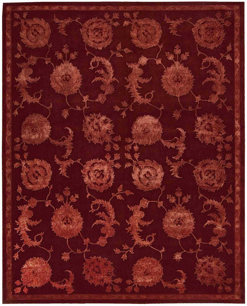 Close-up of the Nourison Regal Garnet Persian rug. Dark brown wool and silk with a floral pattern. Handmade rectangular rug.