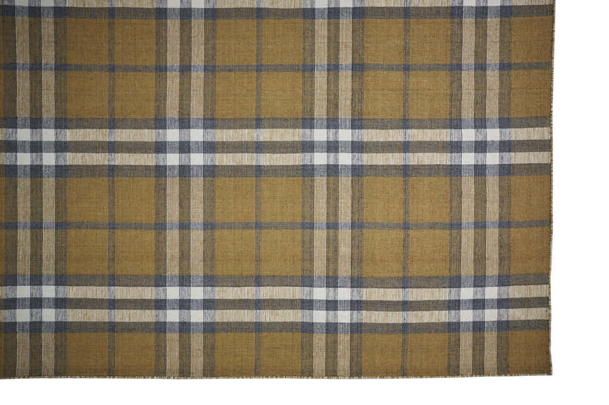 Close-up of Feizy Crosby Transitional Plaid Area Rug. Gold, blue, and white hand-woven polyester rug with a farmhouse plaid pattern. Corner