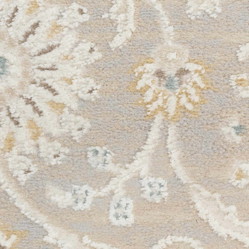 Close-up of Nourison Isla Light Grey Vintage rug showing floral pattern and high pile texture.