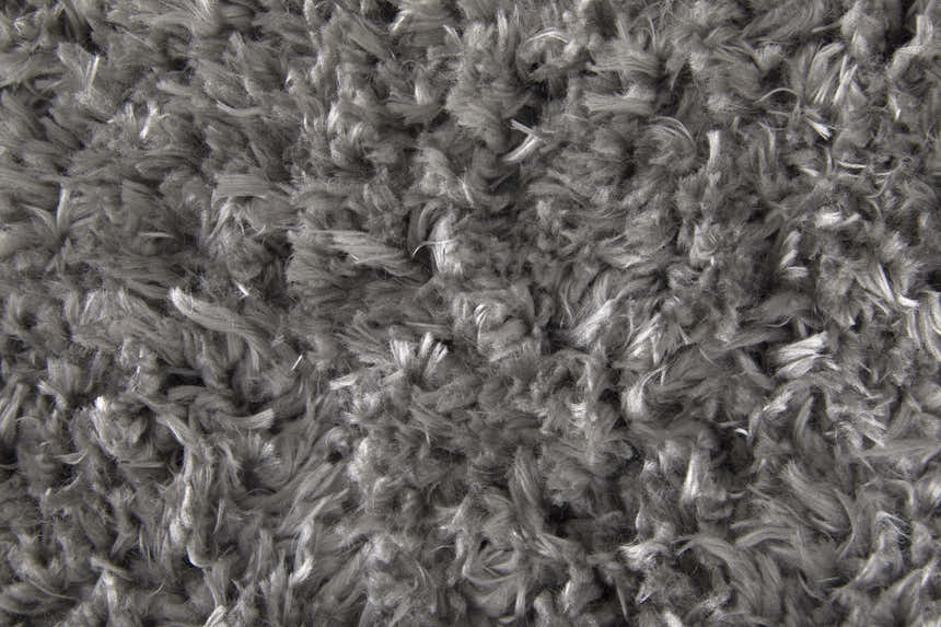 Close-up of the plush texture of the gray Feizy Darian Modern Solid Area Rug. Texture