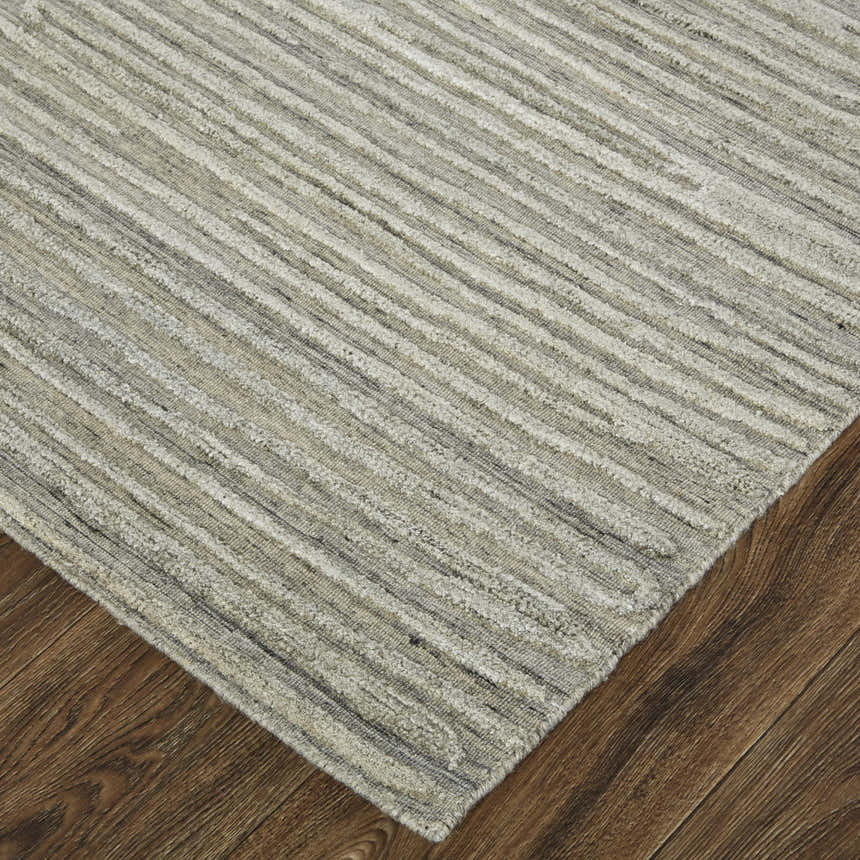 Close-up of Feizy Braeside Taupe/Gray Area Rug. Hand-woven wool and viscose rug with a transitional abstract pattern. Corner