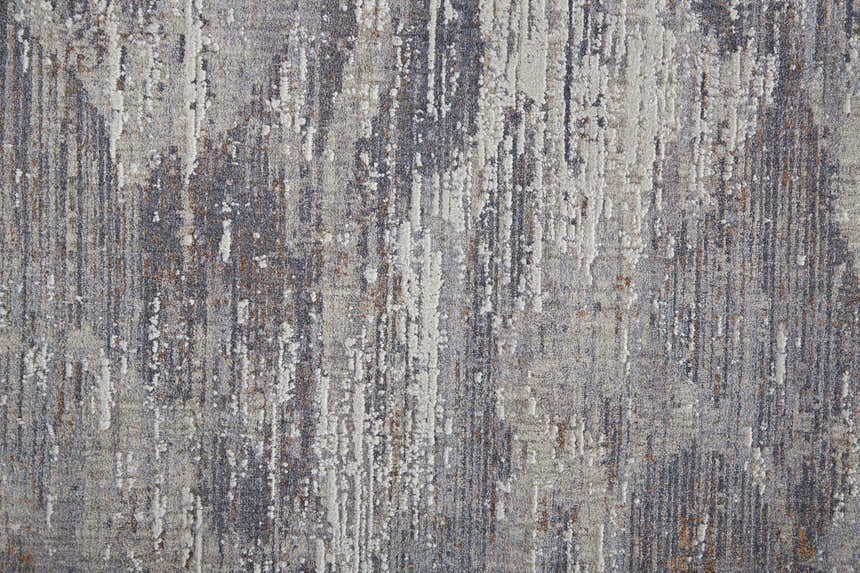 Close-up of Feizy Lennon Taupe/Tan/Orange Area Rug. Abstract design with vertical stripes in neutral and warm hues. Texture