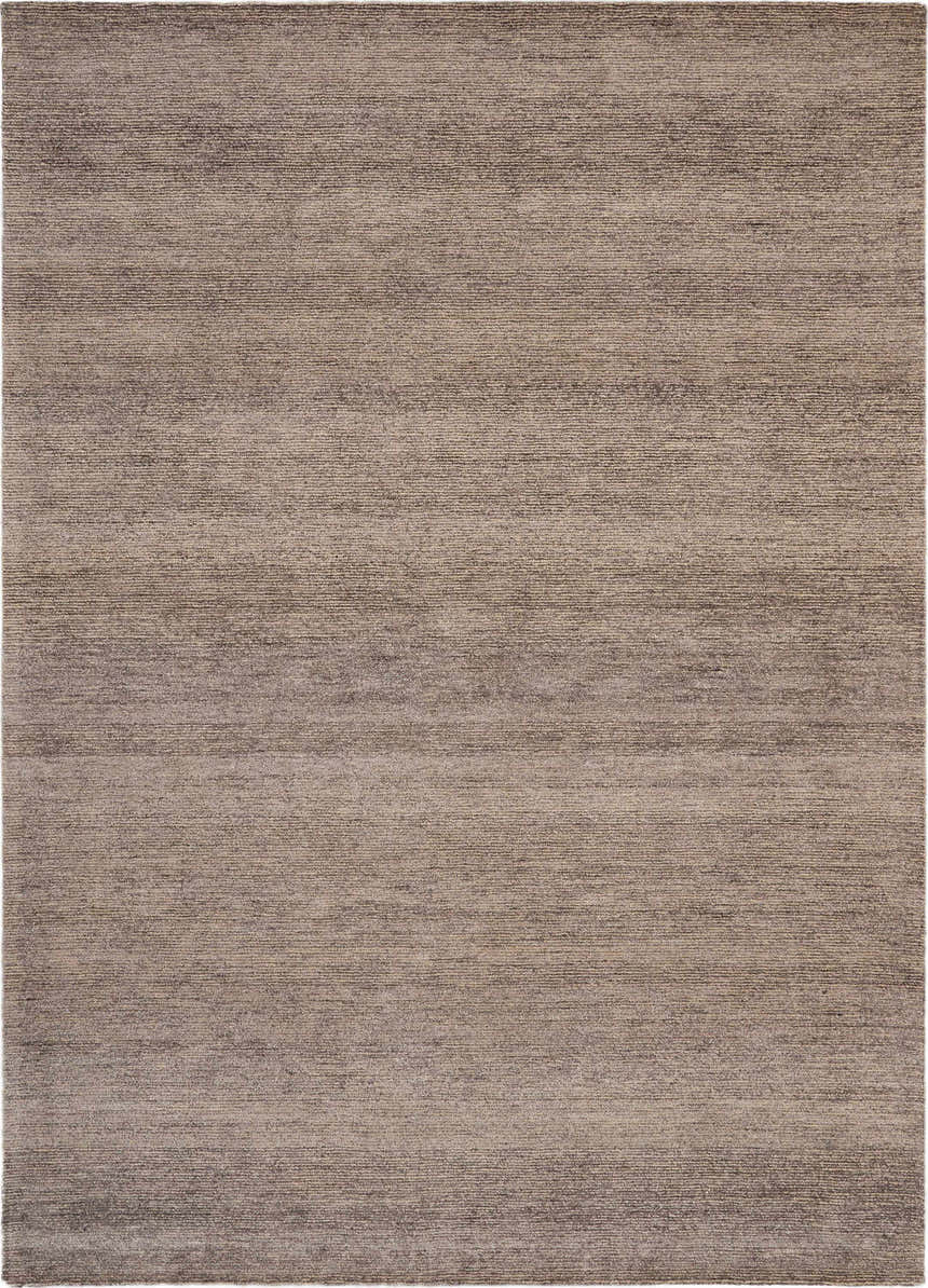 Close-up of the Nourison Weston Charcoal rug. Taupe color with a subtle horizontal stripe pattern and soft, silk-like texture.