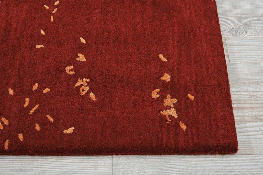 Close up of the Nourison Opaline Fire Vintage Rug, showing the fire red color and subtle gold pattern.